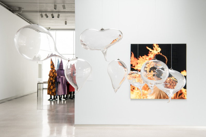 Installation view: Cassils, Encapsulated Breaths and Burn for Camera Still from Inextinguishable Fire, detail; Paul Rucker, Storm in The Time of Shelter, partial view, Institute for Contemporary Art, Richmond, Virginia, 2018. Photo: Terry Brown
