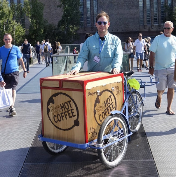 Photo of artist John Freyer and his Free Hot Coffee Wagon