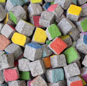 Pascale Marthine Tayou, Colored Stones, 2015-2018. Granite setts, paint, dimensions variable. Courtesy of the artist and GALLERIA CONTINUA, San Gimignano / Beijing / Les Moulins. Photo by David Hale
