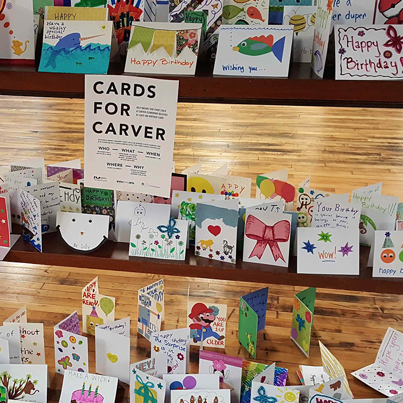Display of community-created birthday cards for students at Carver Elementary