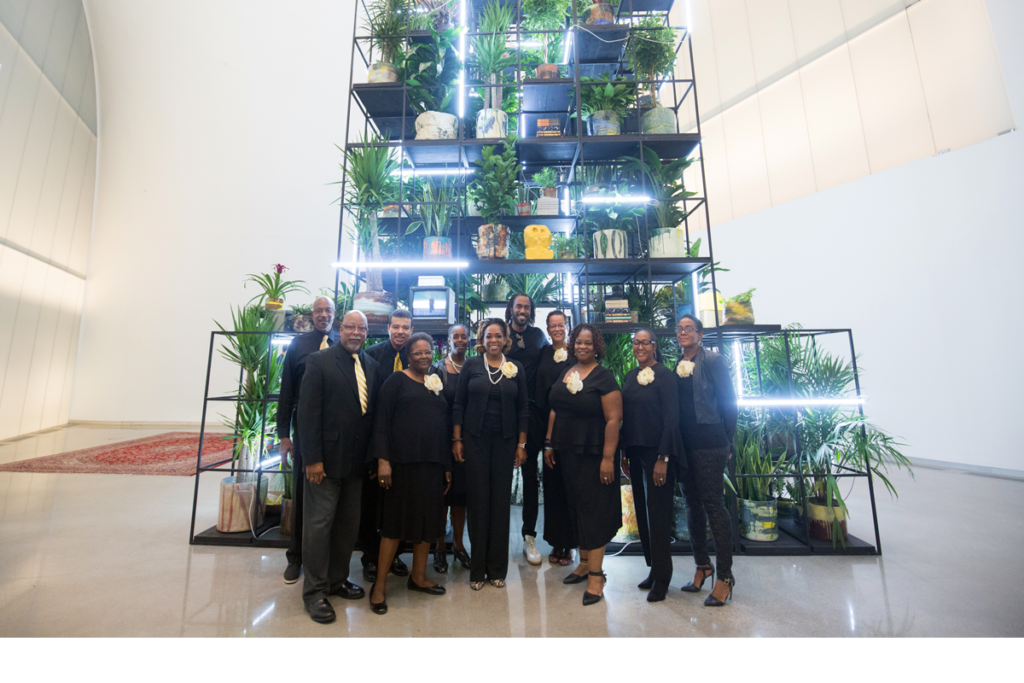 First African Baptist Church Choir stands in front of Rashid Johnson's "Monument" exhibition