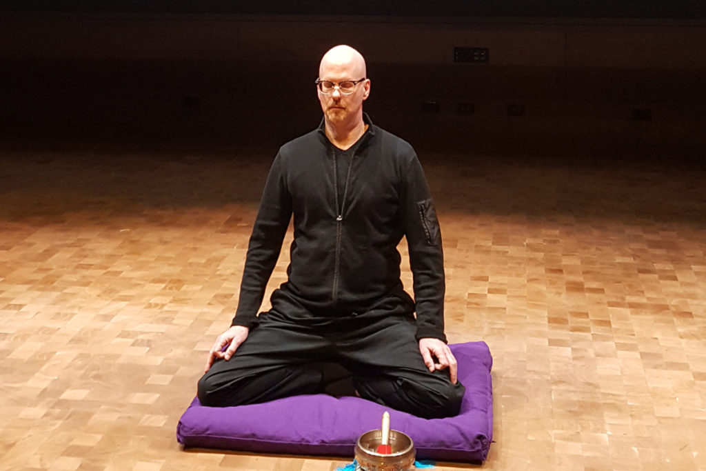 Mindfulness instructor Kirk Warren Brown leads a meditation session