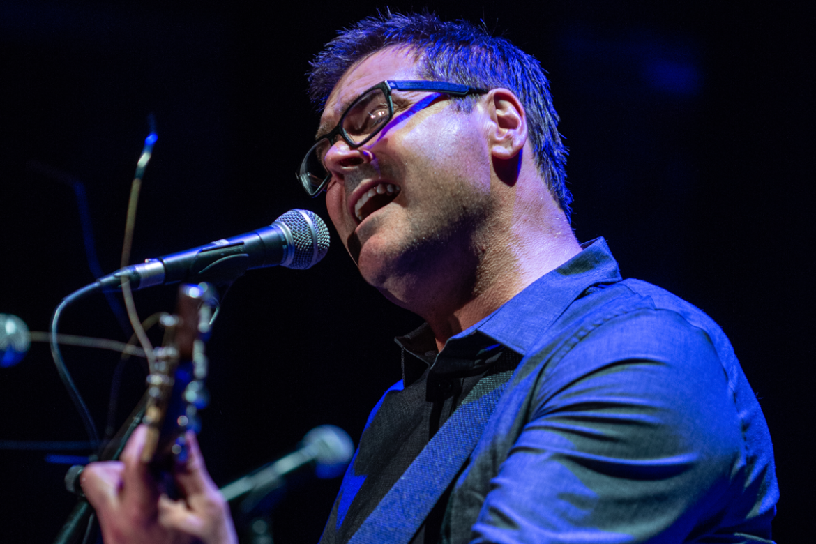 Musician Kyle Davis performs on guitar