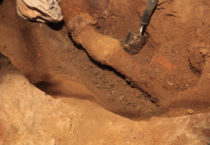 Process shot of trenches being dug beneath Corin Hewitt's home. Underground sewage pipes are slowly becoming visible.