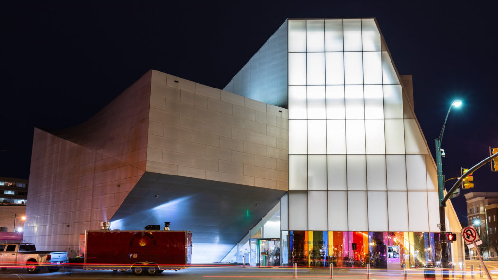 Night shot of the ICA from Belvidere street with Cauleen Smith's rainbow-coloured windows.