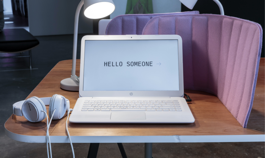 ID: Laptop with text HELLO SOMEONE.